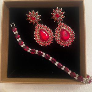 Red jeweled earrings and bracelet